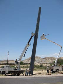 A large diameter three-module RS pole being installed by relatively small equipment for a direct-bury installation